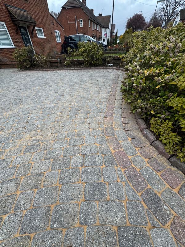 Block paving driveway after jet washing and moss removal